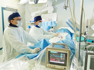 surgeons team at vascular surgery operation