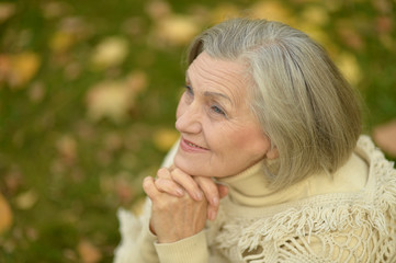 Senior woman in autumn park