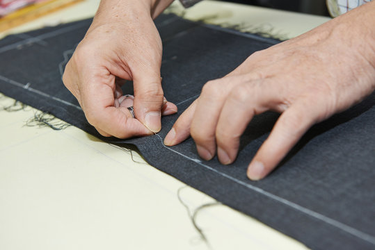 male tailor hands at work