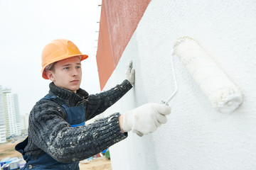 builder facade painter at work
