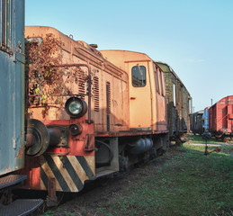 Old abandoned  trains at  depot in sunny day