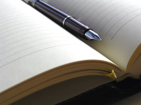 Note book and pen close up