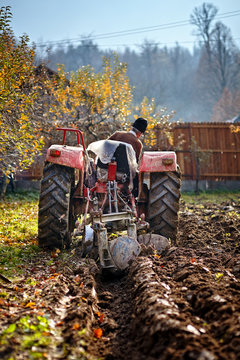 Senior Farmer Plowing