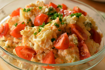 Homemade Potato Salad with Eggs and Pickles In Glass Bowl