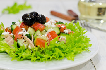 Fresh salad with tuna, tomatoes and cucumbers
