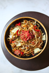 Asian noodles with tofu, shrimp, peppers and sauce