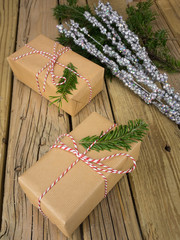 string and brown paper parcels with christmas decoration