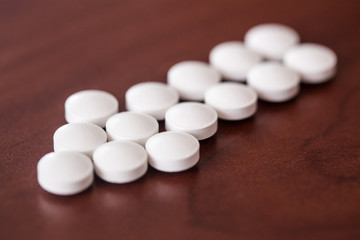 Arrow out  white pills