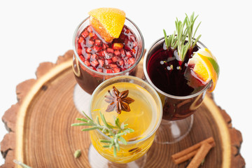Traditional winter hot alcohol drinks mulled wine with orange, s