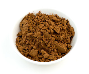 Chocolate cocoa powder closeup macro on white