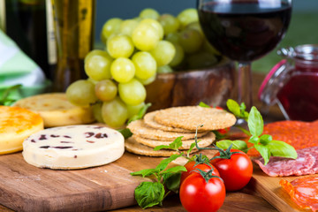 soft cheese with fruits and crackers