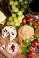 traditional english soft cheese with cranberry sauce