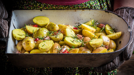 Freshly baked potatoes with garlic and herbs