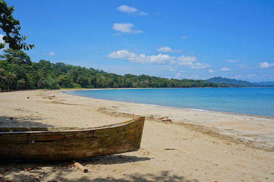 Pristine beach with a dugout canoe Costa Rica
