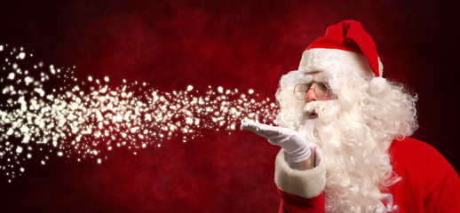Santa Claus blowing snow