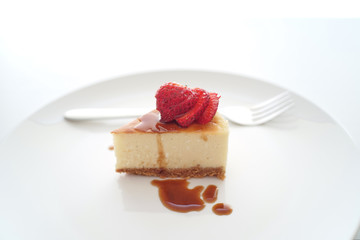 Small slice of cheesecake on a big plate