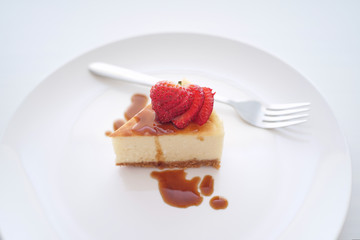 Small slice of cheesecake on a big plate