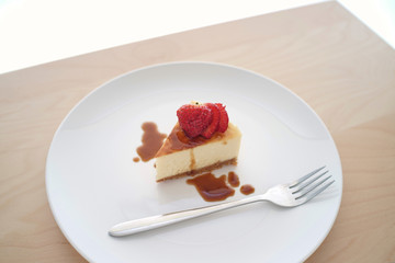 Small slice of cheesecake on a big plate