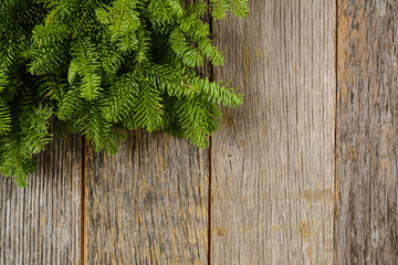 Naklejka premium Tree branch on rustic wooden background used for christmas decor