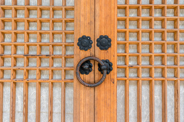 A small brass door knob in a Korean temple.