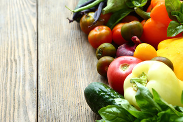 Freshly picked vegetables on a wooden surface
