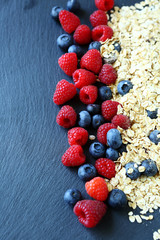 Cereal and blackberries on the slate