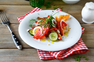 Salad with fresh cucumbers and tomatoes