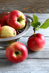 Fresh apples in a metal colander
