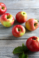 Sweet red apples on wooden boards