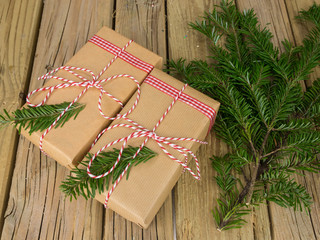 string and brown paper parcels decorated with conifer  and check