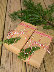 string and brown paper parcels decorated with conifer  and check