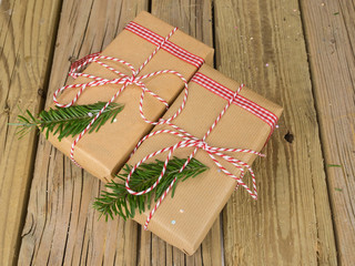 string and brown paper parcels decorated with conifer  and check