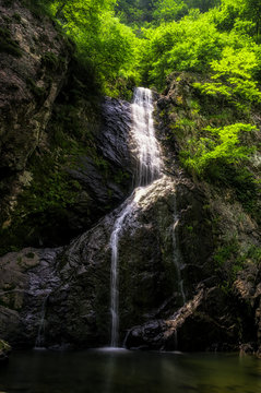 Waterfall over a mossy creek taken in Wanju, South Korea