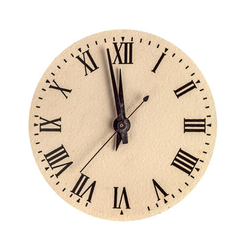 Vintage clock face showing two minutes to twelve