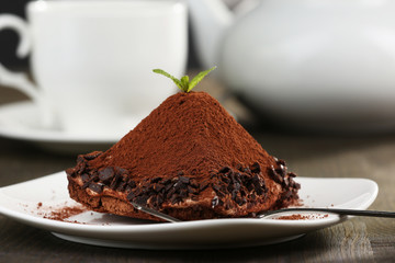 Yummy chocolate cupcake on table
