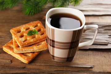 Cup of tea with cookies on table close-up