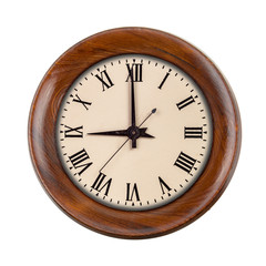 Vintage clockface showing nine o'clock in wooden frame