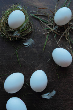 Fresh hen's eggs on the grass nest. Eco food concept