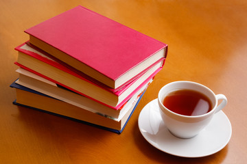 Cup of tea and stack of books