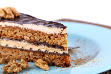 Delicious chocolate cake on plate on table close-up