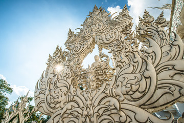 Beautiful Art carving sculpture by national artist in White temple one of the most popular place in Chiang Rai province of Thailand.