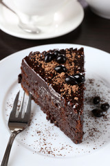 Yummy chocolate cake served on table, close-up