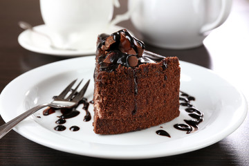 Yummy chocolate cake served on table, close-up