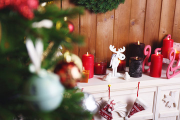 Fireplace with beautiful Christmas decorations in room