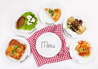 Daily menu. Plates with food on table