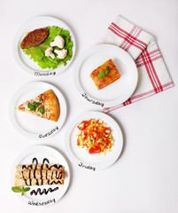 Daily menu. Plates with food on table