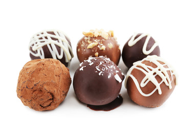 Delicious chocolate candies isolated on white