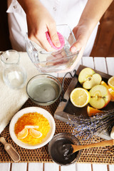Beautician makes cosmetic facial masks, close-up
