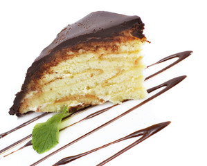 Piece of chocolate cake with chocolate sauce