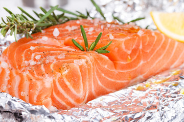 Fresh salmon ready for cooking on the foil paper